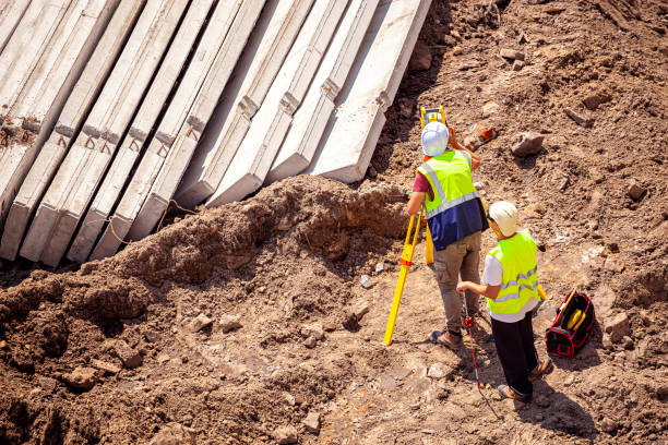 istock Surveyors working at new construction site 1334639818
