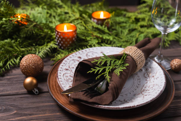 istock Festive table setting with winter decor. Christmas or New Year holiday background. 1334640441