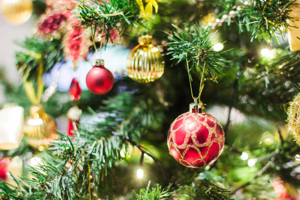 istock Christmas background with abstract bokeh light and Christmas tree toy. Blurred focus bokeh, new year 1334641841