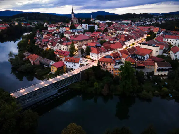 Photo of Evening Cityscape of Novo Mesto in Lover Carniola Region in Slovenia at River Krka Bend. Drone View