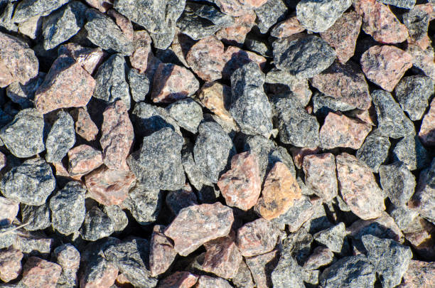 istock Background from many small granite stones. Gravel pebbles stone seamless texture. 1334642742