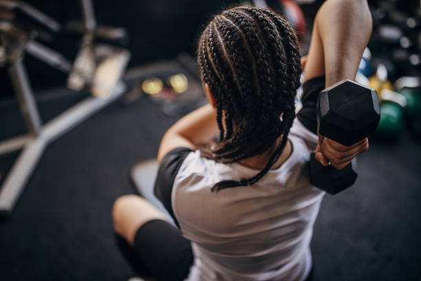 istock Young woman training in gym 1334642849