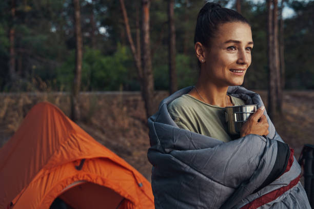 istock Female in woods with cozy blanket on her shoulders 1334645575