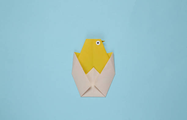 istock Origami chicken on a blue background 1334646854