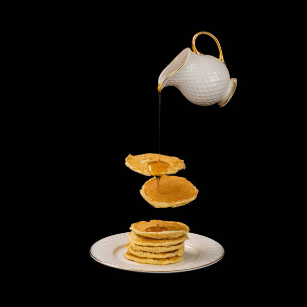 Texture of fresh pancakes with fragrant maple syrup and honey.
