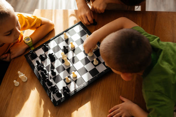 istock High Angle View Of Boys Playing On Table 1334647859