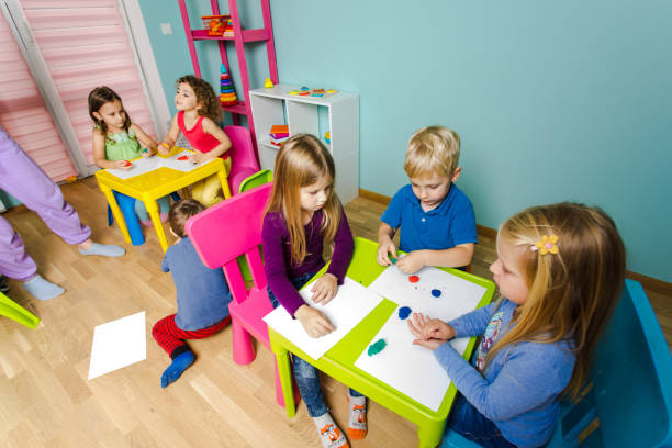 istock Rear View Of People Sitting On Table 1334647872