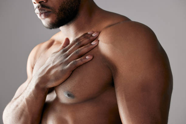 studio shot of a unrecognizable muscular man posing against a grey background - sensuality men shirtless studio shot imagens e fotografias de stock