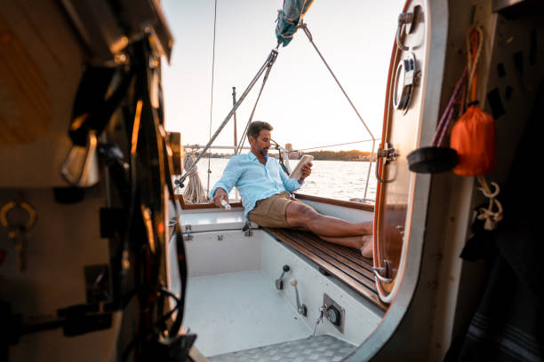 istock Reading a book on the sailboat 1334651988