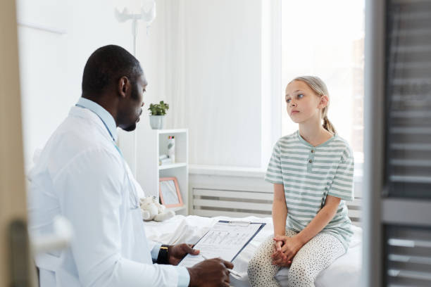 istock Girl at Checkup in Hospital 1334653949