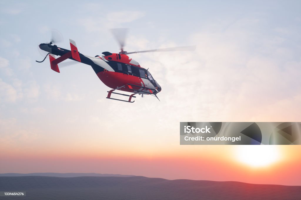 Flying Helicopter At Sunset Helicopter Stock Photo