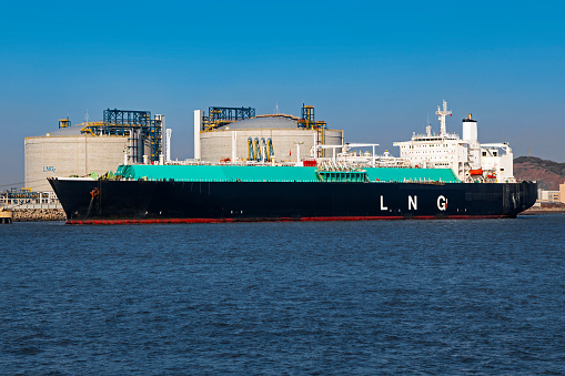 Picture of a LNG (Liquefied natural gas) tanker ship unloading its cargo at Shanghai Yangshan LNG terminal