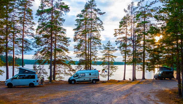 Camping in Sweden Jönköping, Sweden - June 20, 2021: Camping with a European van conversion at a small lake in the forest jonkoping stock pictures, royalty-free photos & images