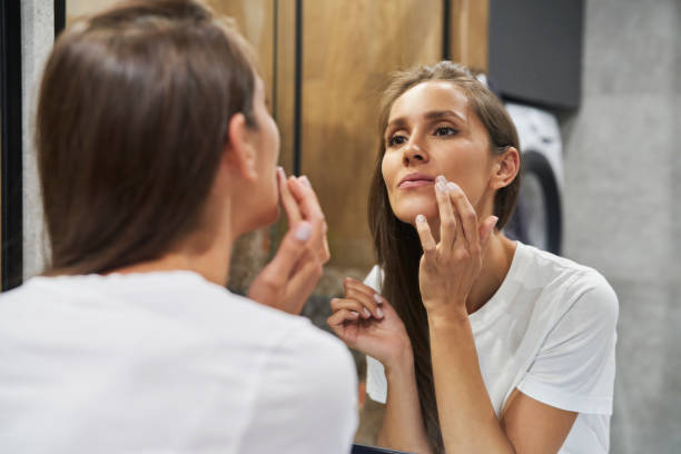 istock Woman browsing face in the mirror 1334656444