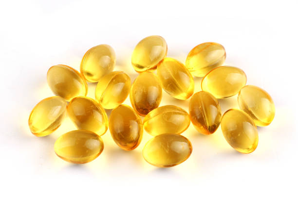 istock Fish oil in capsules on a white background 1334656860