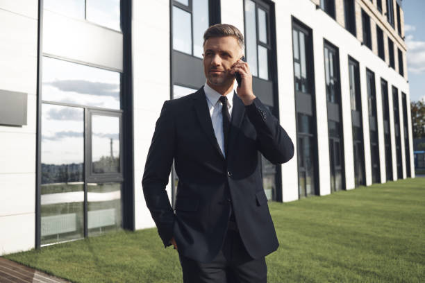 istock Confident mature businessman talking on mobile phone 1334658532