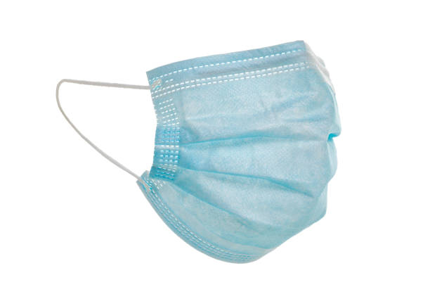 istock Disposable protective face mask. Corona virus prevention equipment isolated on whize background 1334658937