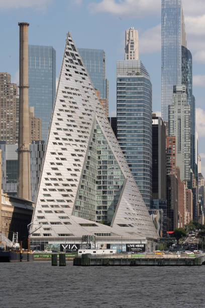 Vertical view of VIA 57 West, a residential building located at 625 West 57th Street between 11th and 12th Avenues in Hell's Kitchen, Manhattan New York, NY - USA - July 30, 2021: Vertical view of VIA 57 West, a residential building located at 625 West 57th Street between 11th and 12th Avenues in Hell's Kitchen, Manhattan logan west stock pictures, royalty-free photos & images