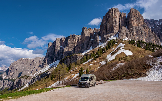 South Tyrol, Italy  - June 14, 2021: Camping with a European van conversion at Passo Gardena in Dolomites