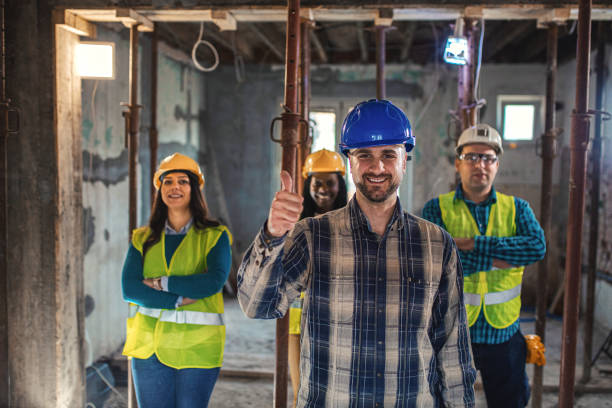 istock Young team of architects and coworkers ready to work on the project 1334661027
