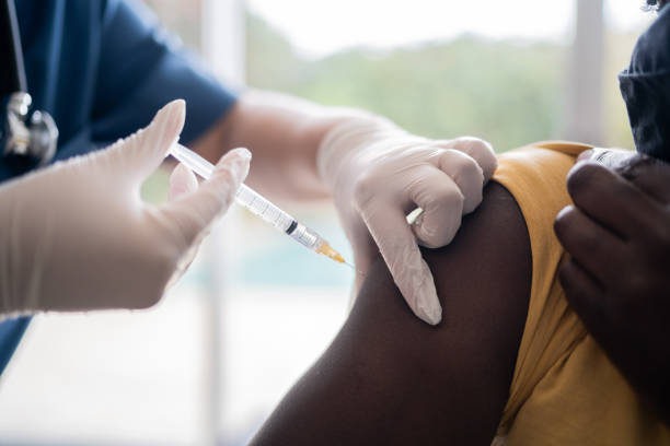 istock Doctor injecting vaccine on patient's arm 1334661691