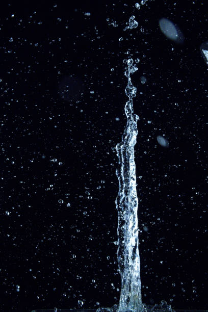 istock Splashing water on black background, abstract art 1334662081