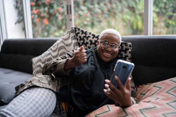 istock Woman doing a video call on smartphone at home 1334662958