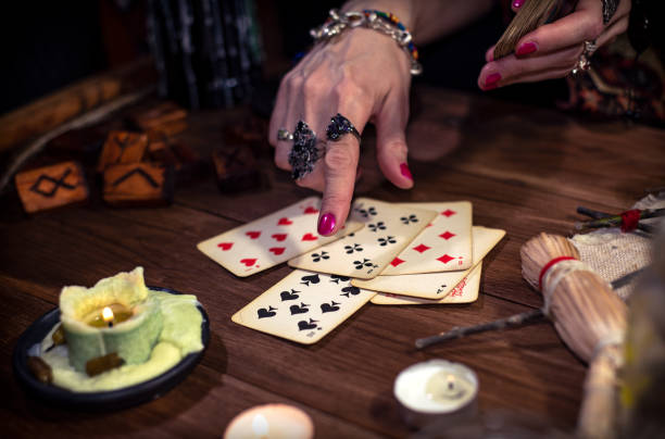 istock Gypsy fortune teller predicts the future with cards 1334664999