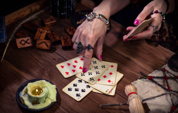 istock Gypsy fortune teller predicts the future with cards 1334665004