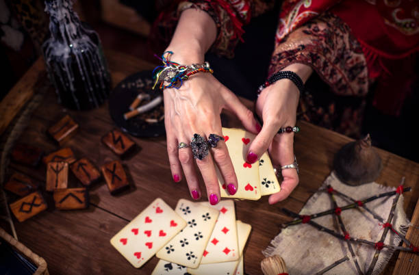 istock Gypsy fortune teller predicts the future with cards 1334665018