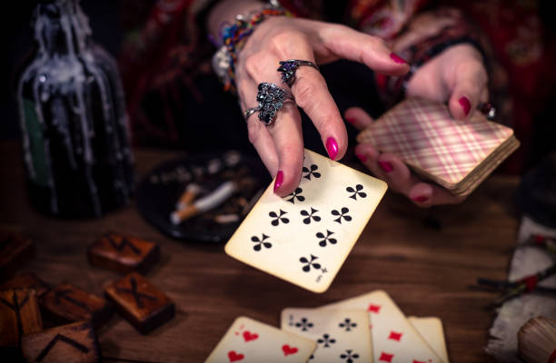 istock Gypsy fortune teller predicts the future with cards 1334665039