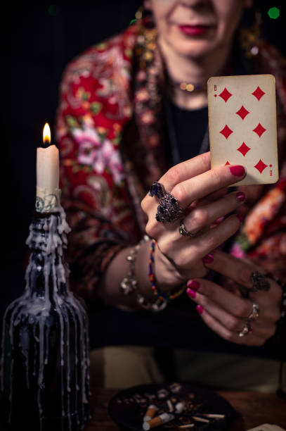 istock Gypsy fortune teller predicts the future with cards 1334665055