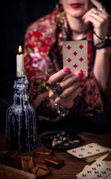 istock Gypsy fortune teller predicts the future with cards 1334665058
