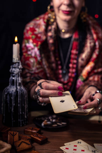 istock Gypsy fortune teller predicts the future with cards 1334665063
