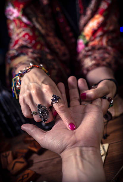 istock Gypsy fortune teller predicts the future by chiromancy 1334665083