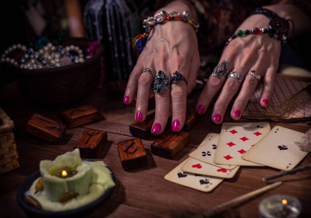 istock Gypsy fortune teller predicts the future with cards 1334665097
