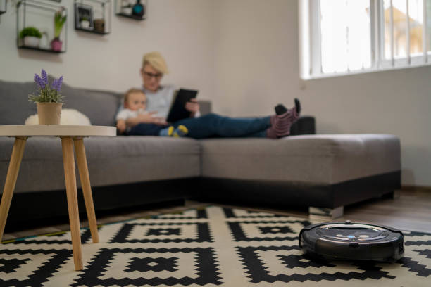 istock Robot vacuum cleaner helps the family 1334665465