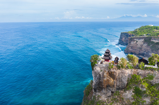 Bali, Pura luhur - temple on the cliff edge in Uluwatu. Ocean on the background.