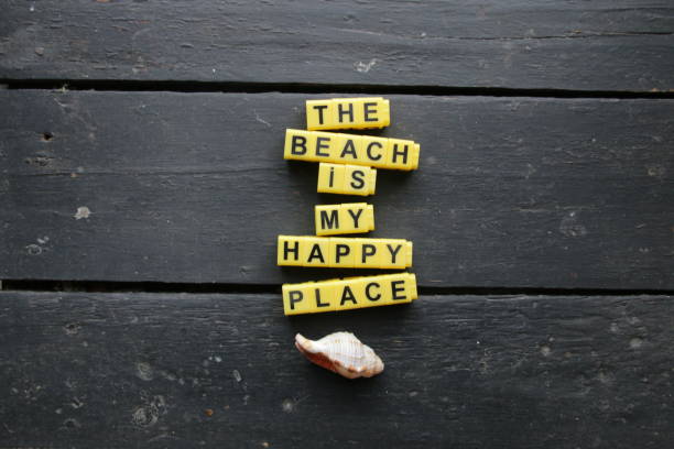 istock Lettering on a vintage table - the beach is my happy place. 1334669565