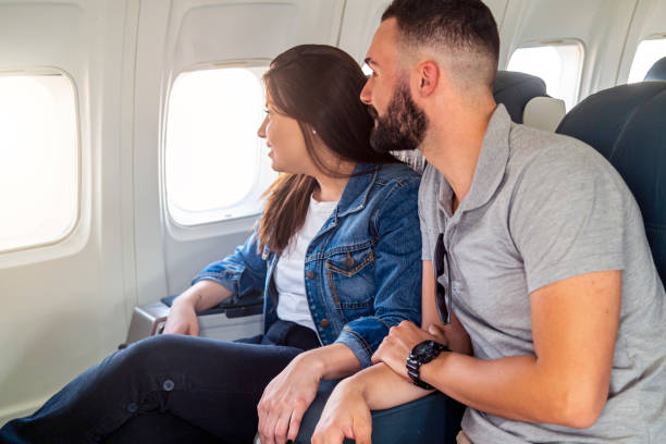 istock Young couple flying 1334670092