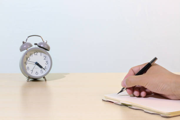 istock Close-up of a hand writing on a notebook, copy space 1334671049