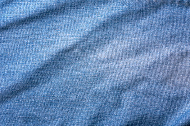 istock Old Blue jeans fabric denim texture background for design. 1334674045