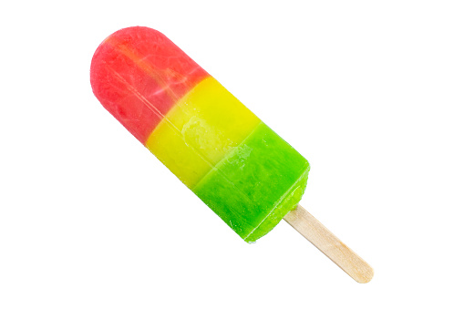 Bright fruit popsicles from three layers on white isolated close-up.