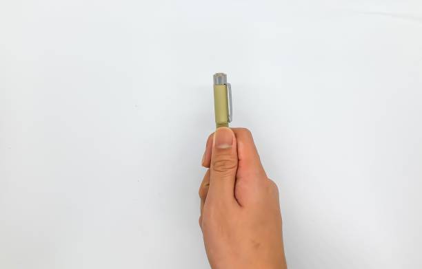istock child's hand holding a pen 1334678601