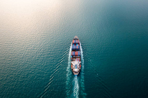 Aerial top view from drone, Container ship or cargo shipping business Service logistic import and export freight transportation by container ship in open sea,