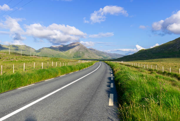 istock Road in Connemara with mountains view on the horizon. 1334680595
