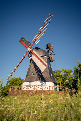 Abandoned Windmill next to the river Ant Norfolk broads blue sky