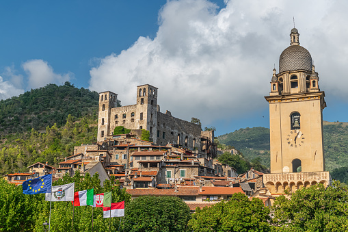 Dolceacqua, Imperia, Italy – 27.07.2021: Dolceacqua is one of the medieval villages of Province of Imperia in Liguria region of Italy. Characterized by the arched bridge and dominated over by the Doria's castle. A cambered bridge with only one arc-span, of 33 metres, that Claude Monet had painted in 1884 defining it \