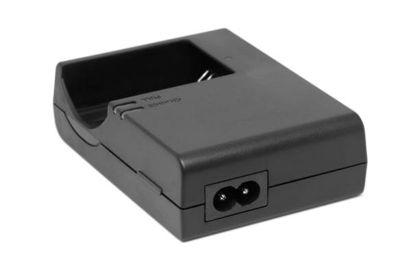 istock Black dslr camera battery charger isolated on white background 1334684060