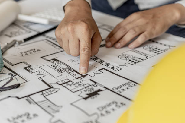 istock The architects reviewed the blueprints that were designed before the presentation, designed the house according to the homeowner's requirements and in accordance with the construction standards. 1334684289